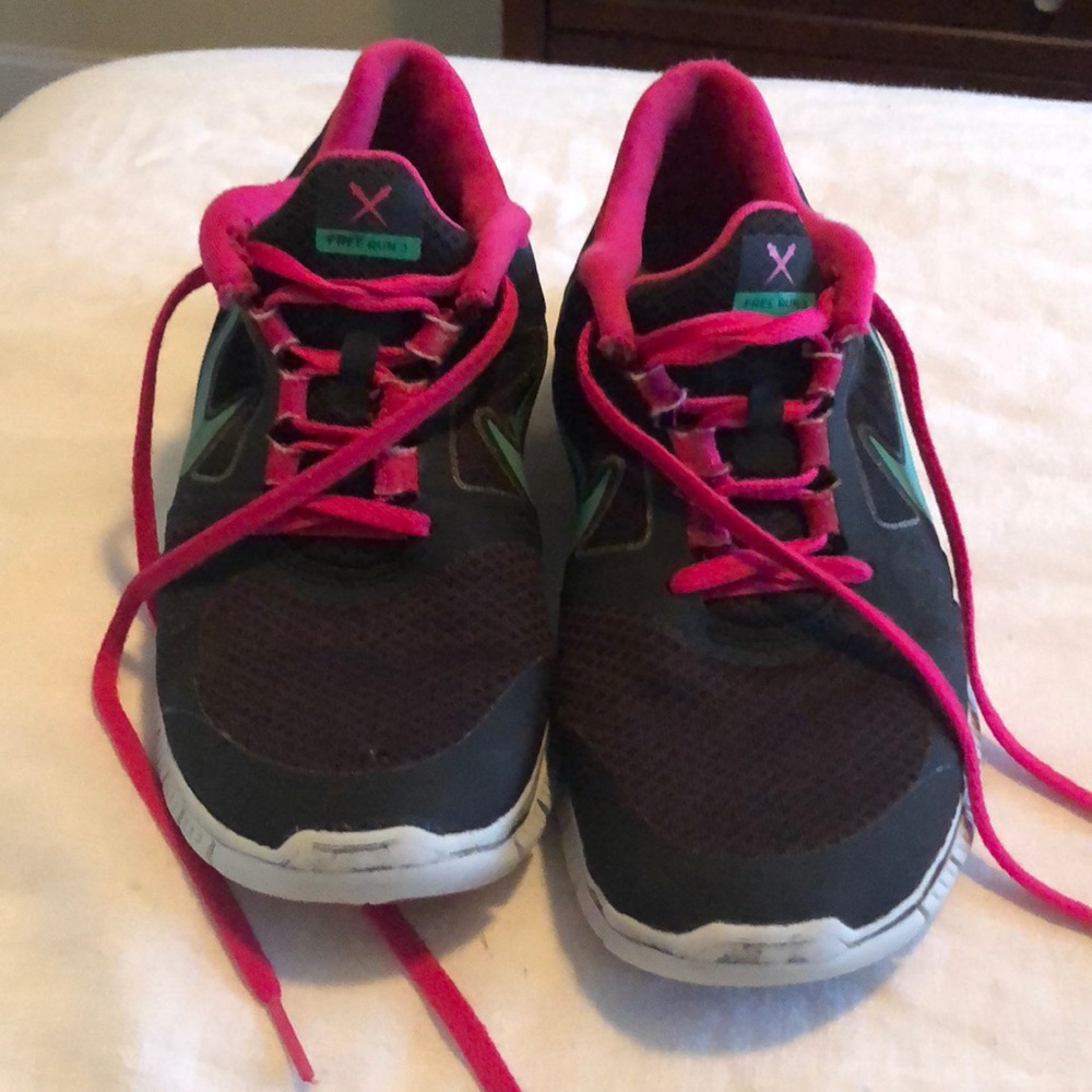 Black with pink and teal Nike Free